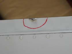 Lightning strike exit burn on elevator trim tab of a Lear jet